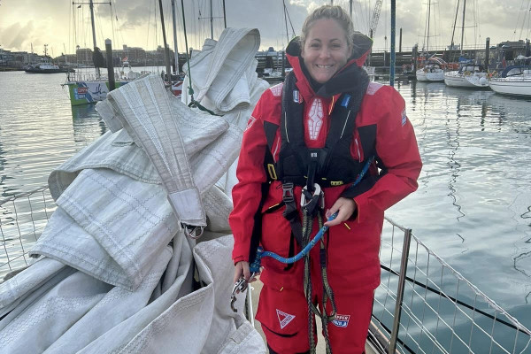 Photograph of Sarah Puntan-Galea in a red immersion suit